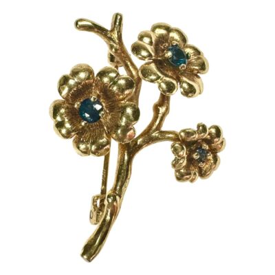 Vintage hallmarked 9 karat gold sapphire flower brooch. Weight 3.9 grams. Main photo of brooch seen from the front with sapphires to the centre of each of the 3 flower heads.