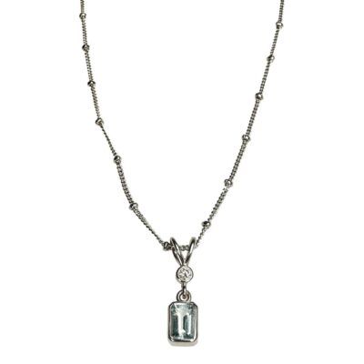 18 karat white gold Aquamarine diamond pendant/ necklace . The total length of the chain is 410 mms x 1.5 mms. The pendant measures 16.5 mms x 4 mms ( including bale). It is stamped 750 on the clasp and tag. Main photo of necklace and pendant seen from the front and excluding the clasp area.
