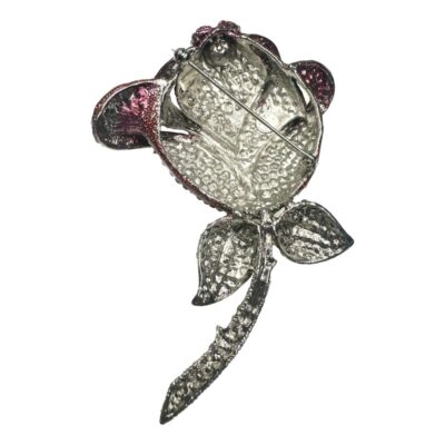 Large statement retired Butler & Wilson rose rhinestone rose brooch. Comes in its original box. Measures approximately 120 mms x 85 mms. Photo of the brooch from the back seen with pin closed. The pin is situated diagonally across the rose head with the clasp end in the top left.