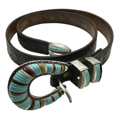 Vintage Native American Zuni multi stone inlay sterling silver belt. The buckle and fittings are set with turquoise, mother of pearl , onyx & coral. The reverse of the clasp is stamped sterling. The buckle measures 60 x 45 x 11 mms. Main photo showing the whole belt wound round with multi stone inlaid buckle and belt loops in the foreground and belt tip to the centre of the wound belt.