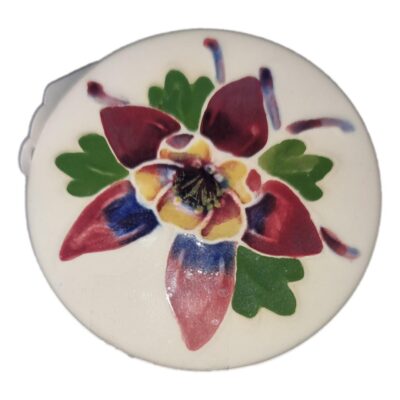 The Moorcroft little pot is a pretty trinket container with a colourful orchid pattern on the lid. Useful for storing small items of jewellery. Main photo showing the orchid decoration to the pot lid.