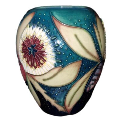 Moorcroft vase in the Albany pattern is highly decorative full of colour and interest produced in the year 2000 by Nicola Slaney. Main photo of vase seen from an eye lvel angle showing the Albany decoration to the side.