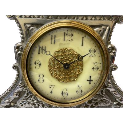 Early 20th century antique 'Strut' timepiece in good working order. Should be fully wound every days. Clock face measures 85mm in diameter. Finial at the very top of the clock frame is a little bent otherwise in excellent condition throughout. Fully serviced and guaranteed for 1 year. COLLECT FROM STORE ONLY. Close up photo of the clock face.