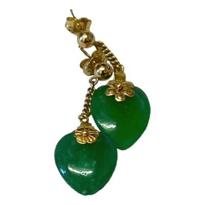 Antique apple green jade hearts on 18karat gold Chinese flower mounts with modern 18karat gold chain and studs. Jade c1880. Hallmarked 750 to back of one stud and 18kt to both butterflies. The size of the jade hearts and flower mounts vary in size with one smaller than the other. This does not distract from the quality & beauty of these earrings but rather gives a quirky unique charm. Drop length 32mm and 36mm consecutively. Main photo of earrings laid together on a flat surface with one on left slightly lower than the other. The green of the jade is very deep.