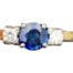 Vintage 18 karat gold trilogy ring set with a round cut sapphire of approximately 0.25 carat to centre with a 5 point sparkly diamond to either side. Ring size N / 6.75. Main photo showing ring front.