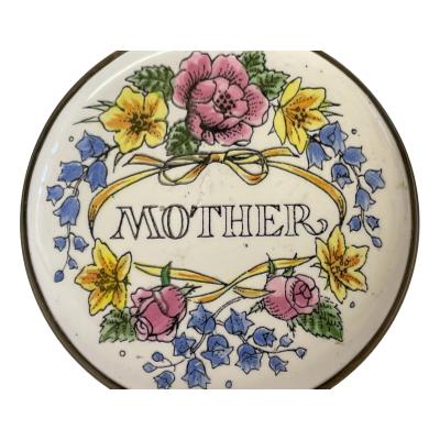 Photo of base of box showing the makers stamp. Close up photo of the decoration to the top of box.