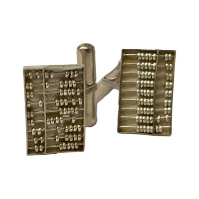 Vintage sterling silver abacus cufflinks c1960s. Fun pair of cufflinks with moving upper & lower beads. Stamped Hong Kong Sterling D.D. to the back of each. Abacus measures approximately 20mm x 10mm. Length of cufflink approximately 15mm. Photo of both cufflinks displayed on their side with the beads moved to show they are fluid.