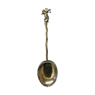 Antique sterling silver spoon with a twist handle and cupid to the handle tip. Full hallmark to back of cupid for c1882 London assay. The shallow spoon bowl measures 37mm by 30mm. Main photo showing full length of spoon with cherub at the top.