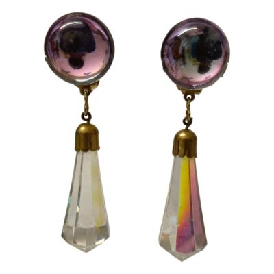 Vintage pair of clip on earrings with aurora borealis crystals. Lovely colours to the hanging crystals while top round crystals remain clear or pink. Drop length from top of circulat crystal to tip of hanging ones is approximately 65mm. The circles measure 18mm in diameter and hanging crystal is 40mm. Main photo of earrings shown hanging (no support bar visible) with pink/lilac colour to the discs at top and clear crystal to left and multi colour crystal to right earring.