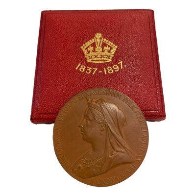 Queen Victoria commemorative medal for her diamond jubilee. A collectable bronze medal in original fitted case with a young Victoria c1837 to one side and reverse has image of the then queen in 1897. Medal measures 55mm in diameter. The clasp of the case is not working and does not close shut. Main photo of medal displayed leaning against the closed fitted case and showing the later Queen Victoria side of medal.