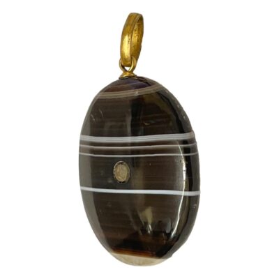 Victorian banded agate pendant with a stanhope inclusion showing images of Oban. Finished with brass bail & fixing.        Pendant drop length 45mm. Photo of stanhope pendant shown upright and set at a slight angle so one flat side is facing towards the bottom left.
