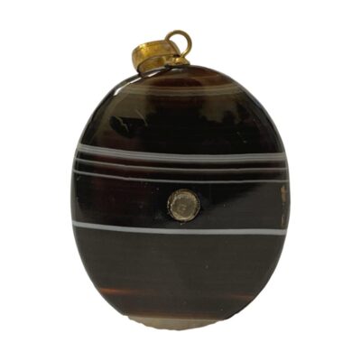 Victorian banded agate pendant with a stanhope inclusion showing images of Oban. Finished with brass bail & fixing.        Pendant drop length 45mm. Main photo of pendant shown upright and straight on with the stanhope visible to the centre.