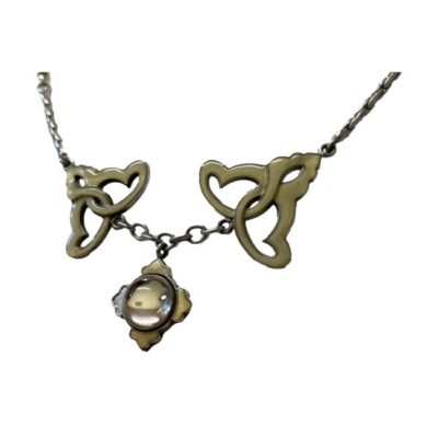 Art Nouveau style necklace by Lalique. Pretty sterling silver necklace embellished with pale golden yellow enamel and an attached small domed glass pendant. Necklace has room for slight length adjustment either side of the 410mm it is set at. Pendant drop length approximately 22mm. Close up photo of the pendant lower area of the necklace seen from a slight side angle.