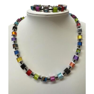 Necklace and bracelet set by Coeur de Lion. Colourful necklace and bracelet both with vibrant cubed crystal glass beads. Evokes images of sun, sea & summer! Necklace measures 410mm at shortest and can be extended to 450mm. Bracelet measures 185mm extendable slightly to 205mm. Main photo of both necklace and bracelet displayed on a stand. The bracelet is on the top of the display stand.