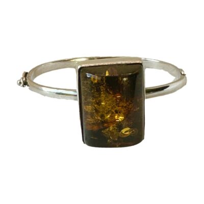 Modernist, vintage 925 silver amber bangle. The bangle has a Czech silver hallmark ( 1949 -1962 ). The amber has a lot of attractive seed inclusions & measures 25 x 30 x 15. The internal diameter of the bangle is 60 mms x 45 mms. Weight 27.9 grams. Main photo of bracelet seen with the large amber at the front. The clasp area can be seen to the left.