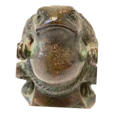 Antique small bronze figure of a frog in sumo pose. Fabulously detailed small bronze of a frog clad in sumo 'Tsuna' (rope) garment and seen in a typical sumo pose. Has a slight wobble when standing so not quite a Yokozuna. Close up photo of the sumo frog seen focused on face and belly area. He looks very serious and in the sumo zone.