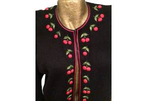 1950s Black lambs wool cardigan with red cherries detail around the neck, along the hook and eye fastening at the front and around the cuffs. Fully lined with no faults in perfect condition, good size 12/14….Rockabilly Swing.  Close up focusing on the cherries at the front of cardigan