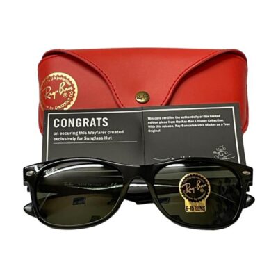 Modern pair of Wayfarer Ray-Ban x Disney sunglasses. New and never worn modern pair of limited edition Ray-Ban sunglasses cebrating Mickey Mouse! Very subtle with Mickey only visible on the arms of the glasses. Comes complete with red vinyl case, red cleaning cloth, certificate of authenticity all in original box. When fully open measures 135mm at arm tips. Photo of glasses displayed folded in front of the certificate which is in front of the closed glasses case.