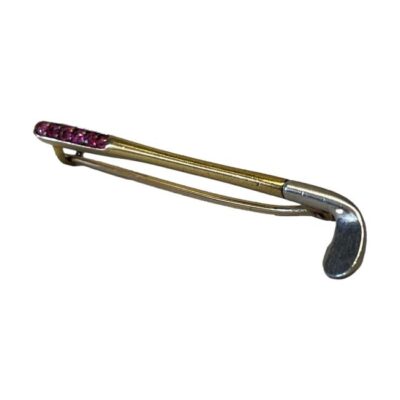 Art Deco golf putter brooch. Fabulous brooch in the form of a putter with platinum head, gold bar and handle set with 6 small round cut rubies. Tested - no visible markings . Weight 2.5gms. Photo of brooch shown at a slight angle with the platinum putter end in the foreground to the right and the ruby handle towards the top right. The pin is closed and visible below the club.