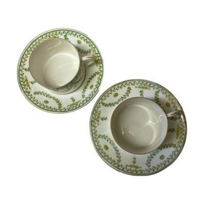 Pair of antique Paris cups & saucers. Nice sized cups with matching saucers in lovely spring colours of yellow and green. In good condition for 19th century items with only minor gilt wear. Cup measures 72mm in diameter at base, 75mm across top and 54mm tall. Saucer measures 143mm in diameter and 25mm high. Photo of both cups on the saucers and seen from above looking directly down.