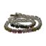 Sterling silver bracelet with multi-coloured tourmaline. Modern silver tennis bracelet set with oval cut tourmaline in a variety of colours with a rainbow like look. Hallmarked 925 for sterling silver, the clasp pin end is marked metal. Main photo of bracelet laid out in a spiral on a flat surface. Some of the different colours of tourmaline are visible in the foreground and the settings for the stones seen in the background.