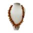 Vintage Baltic amber necklace. Nice length Baltic amber necklace with mostly cognac amber and the occasional butterscotch and egg yolk pieces. Amber screw clasp. The largest piece at the front measures 30mm long. 62gms. Main photo of necklace displayed on a stand and seen forward facing.