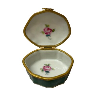 Small porcelain box by Paris. Lovely small forest green scallop shaped box by Paris porcelain. Hand-painted with colourful flowers framed within gold to the top with a single pink rose to inside of the box and lid. Finished in a brass edge with small scallop opener to the front. Signed to the base. Some minor signs of wear to the brass. Photo of box shown open to reveal the hand-painted single pink rose on the inside of the lid and box.