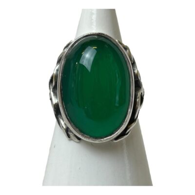 Silver ring set with a chrysoprase cabochon. Beautiful large chrysoprase cabochon set in silver with Celtic inspired rope work to the shoulders. Stone measures 20mm by 12mm. Ring size L / 5.75. Main photo of ring displayed ona cone shaped stand and seen with ring front forward facing.