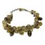 Sterling silver quartz crystal bracelet. Vintage bracelet set with faceted quartz, smoky quartz and tiny faceted cranberry quartz beads. Hallmarked 925 to the clasp. Length adjustable from 185mm to 215mm. Main photo of bracelet laid on a flat surface in a circle with clasp closed..