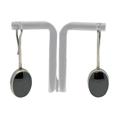 Pair of Modernist silver & hematite earrings. Wonderfully aesthetic pair of sterling silver earrings set with an oval hematite to each. These earrings have an Art Deco look about them although they are from the 1970s. Made by renowned American jeweller & sculptor Robert Lee Morris. Hallmarked RLM 925 to the back. Drop length 47mm from top of hook. Photo of earrings on a display stand seen with earring fronts facing forward.