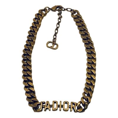 Dior J'Adior necklace. Antiqued chunky bronze choker/collar necklace with 'J'ADIOR' to the front by Christian Dior. Slightly adjustable from 365mm to 445mm and approximately 10mm wide. Min photo of choker laid out on a flat surfacewith the lettering J'Adior along the centre bottom of picture and the clasp area to the top. The extension chain is shown hanging down the middle top.