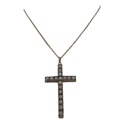 9 karat gold cross with opals on chain. Pretty rose gold cross embedded with opal stones which have a subtle colouring with bright flashes in certain light. Both the cross and chain are in rose gold with a hallmark of 9 karat to the yellow gold clasp only. The cross measures 48mm long from top of bail and 26mm wide. Main photo of necklace showing the cross pendant and a small area of the chain. The cross is forward facing.