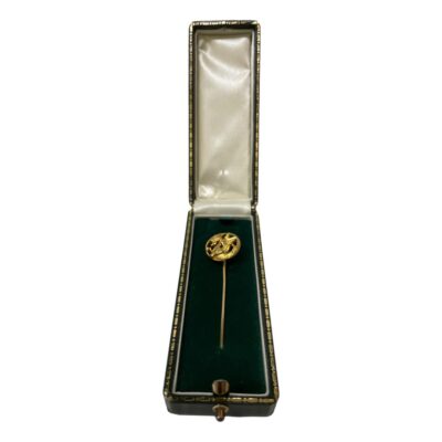 Victorian gold stick pin with griffon. Antique 18 karat gold stick pin with a griffon disc to the tip. The head, forelegs and wings of the griffon are to the centre with tail acting as the frame. Hallmark is worn but 18k is just visible to the top of the pin. Measures 68mm long and the griffon disc is 15mm in diameter. Weight 4.9grams. Main photo of pin displayed inside its box,