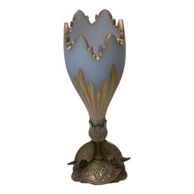 Victorian vase in 2 sections. Very elegant Victorian vase with a detachable opaque glass top and bronzed silver plate base. The opaque glass top, shaped like a crocus flower, is in a pale blue grey with the top rim and indents to the side in gilt. The bronzed silver plate base has 3 feet and is decorated with birds at the end of the scrolls. Glass area of vase measures 265mm tall including the part that slots into base and 80mm in diameter across the top. The base is 180mm tall feet are 132mm apart. Photo of vase from a slightly raised angle looking just into the mouth of the vase.