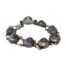 Main photo of bracelet displayed in a circle on a flat surface with clasp closed The bracelet is formed with the shells on silver discs which are linked together with 2 chains per shell. The clasp also houses a shell so when worn, the bracelet is uniform all round with the clasp shell only slightly raised above others.