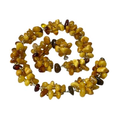 Photo of necklace shown laid on a flat surface with clasp undone and displayed in a swirl pattern.