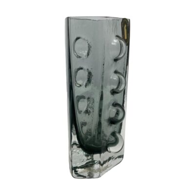 Photo of vase taken from an eye level and posed at an angle so the one front and side is shown, The traffic light circles are also visible to the unseen side.