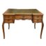 Vintage French writing table. A very attractive French writing table with carved detail, cabriole legs and green tooled leather top. 2 small drawers to the left and right and one drawer to the centre with a single key which locks all drawers. Height 745mm. Desk top measures 995mm by 600mm to the sides and 540mm in the middle. Legs at widest bowed area 1005mm by 595mm. Collect from store only. Photo of writing table seen from the front with beautiful bowed cabriole legs to the front and green tooled leather to the top. 2 small drawers to the left and right one above the other and larger drawer to the centre. An inspiration to get to work if ever there was one! A beautiful piece of French furniture.