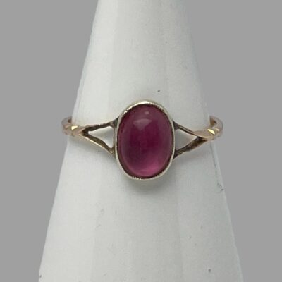 Photo of ring displayed on a cone shaped stand with the ring front forward facing.