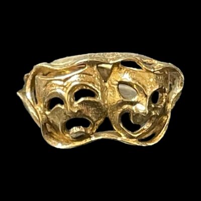 Photo of ring seen from an eye level against a black background. The ring is seen from the front.