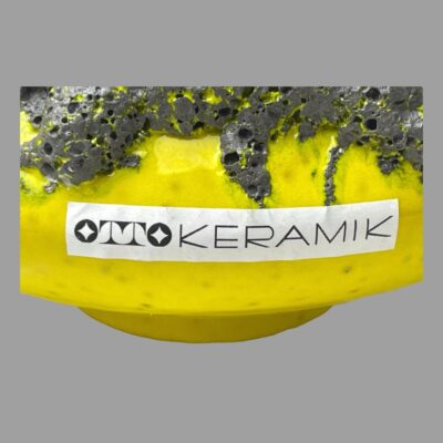 Close up photo of the original Otto Keramik sticker on the side of the UFO.