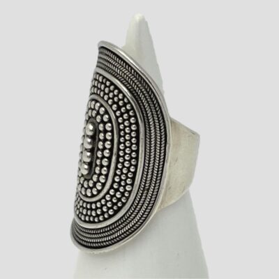 Photo of ring displayed on a cone shaped stand with ring front facing left.