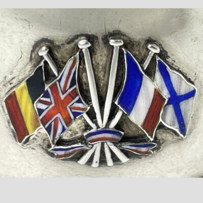 Close up photo of the enamelled flags shown from left to right ; Belgian, British, French and Russian Empire.