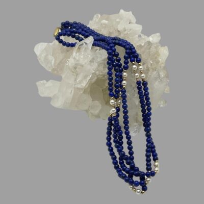Main photo of necklace laid across a cluster of quartz crystal with the pearl areas together in the middle and at the front end. The clasp is just visible to the top. This necklace can be worn with each strand free hanging or the 3 strands twisted around. We have gone for a mixture of the 2 options in our phtos.