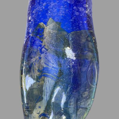 Close up photo of one side of the vase showing the silver and gold leaf work which is superimposed on the bubble vase.