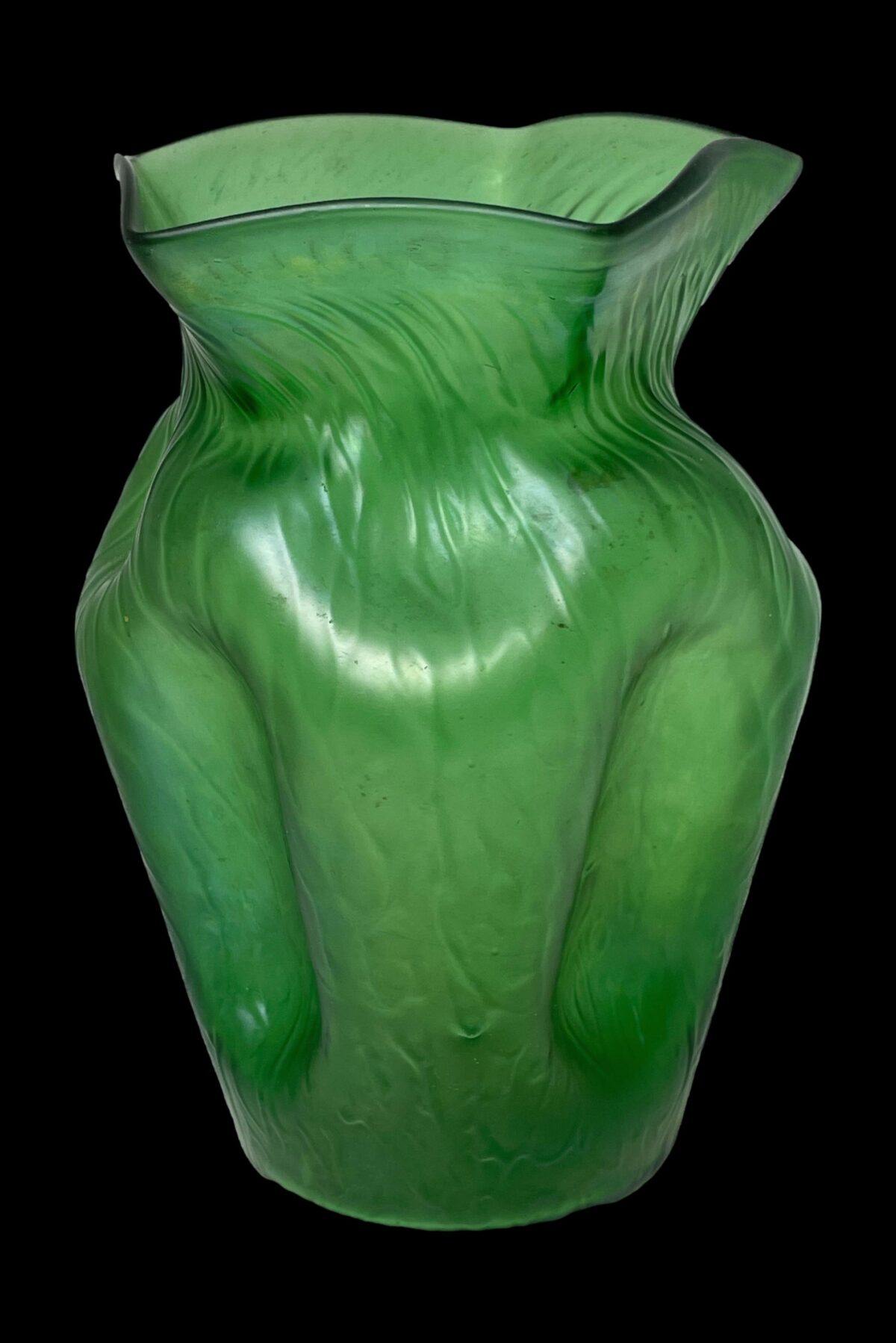 Close up photo of the bulbous area of the vase showing dimpled sides on the left and right and top.