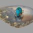 Main photo of the ring displayed on top of a slice of natural agate and shown with ring front facing forward.