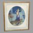 Main photo of the painting seen straight on and from a very slightly raised angle The frame is gilded wood and there are 2 mounts square and oval to centre. The painting is primarily different shades of blue; the dress, the trees, the sea with the big cats and other items in brown and gilt. The colours of the whole painting including the frame compliment the whole. The lady is facing out towards the sea. She is very beautiful with fine slender features. The cats are also looking the same way.