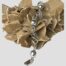 Main photo of bracelet displayed laid across a rock of desert sand rose with one end in the centre foreground. The alternating ball & cage twist links are very striking and eye catching.