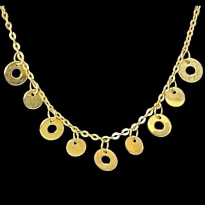 Close up photo of the alternating ringed and whole discs at the front of the necklace.